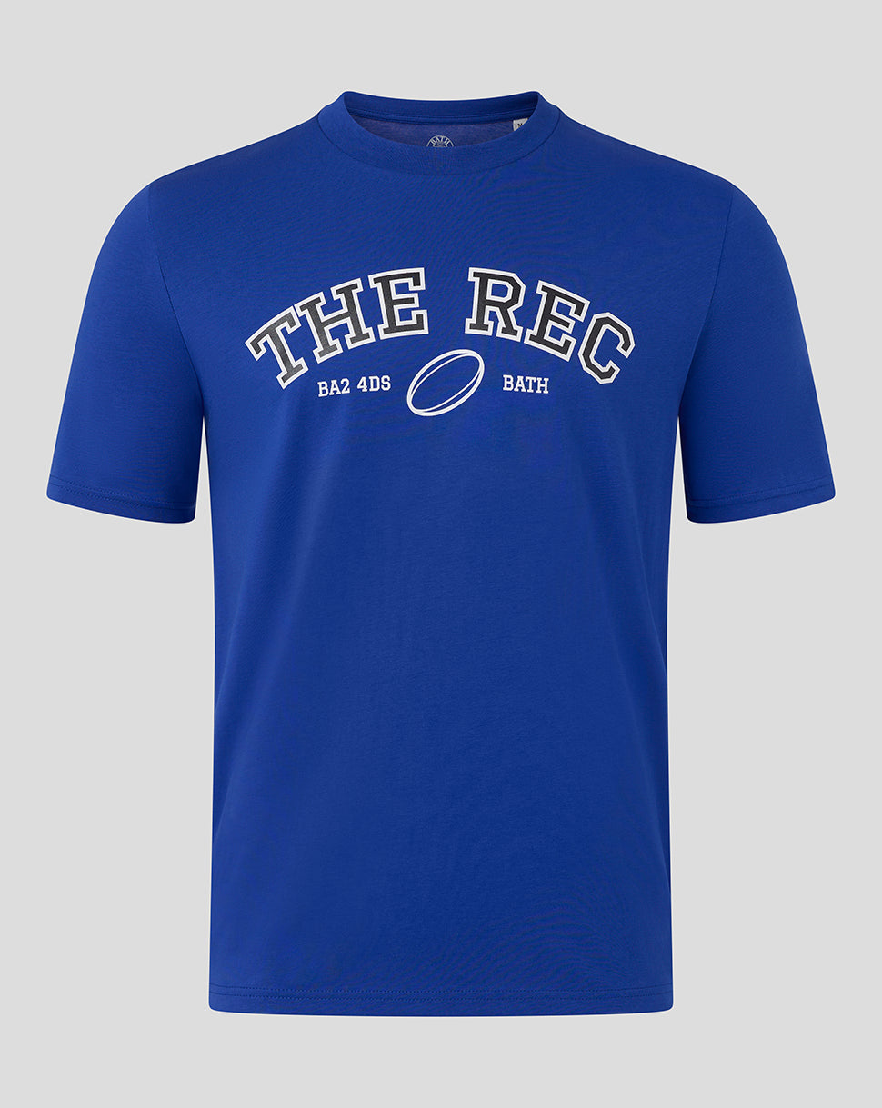 Front view of Bath Rugby Unisex The Rec Tee in blue with bold white THE REC lettering and a rugby ball graphic