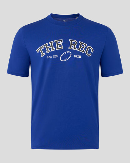 Front view of Bath Rugby Unisex The Rec Tee in blue with bold white THE REC lettering and a rugby ball graphic
