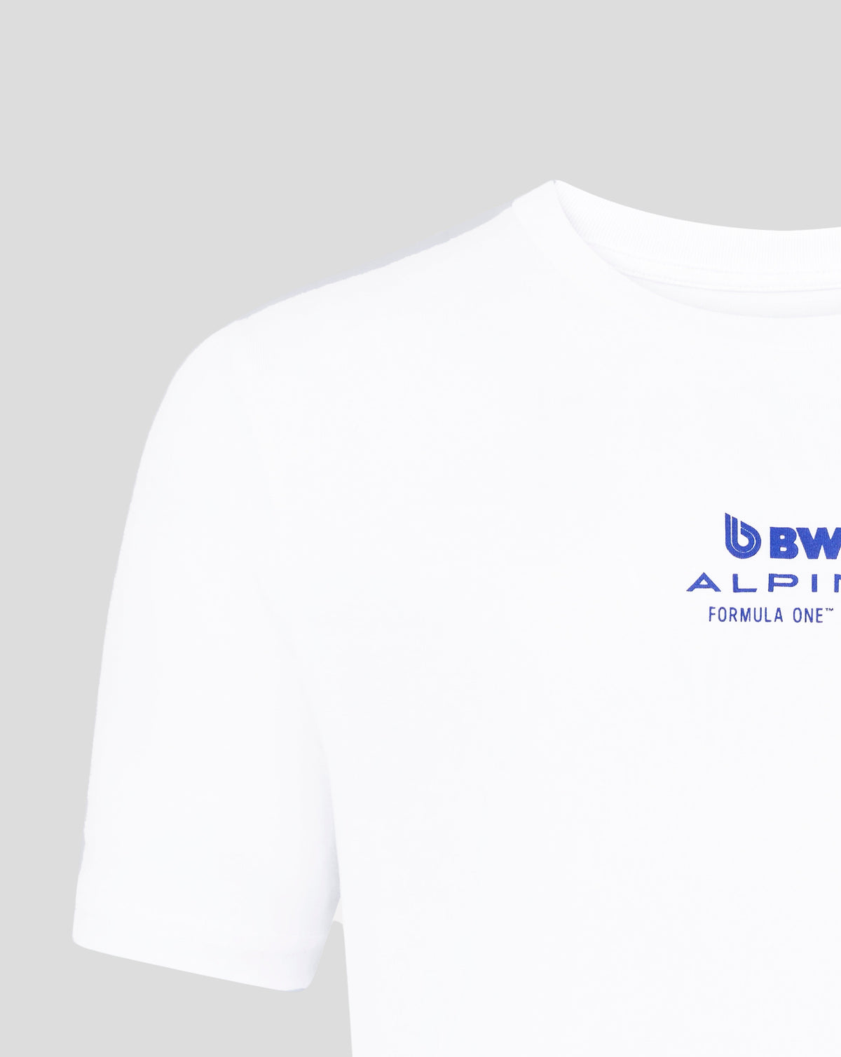 Close-up of a white Core Driver T shirt with a blue BWT Alpine logo near the lower chest.