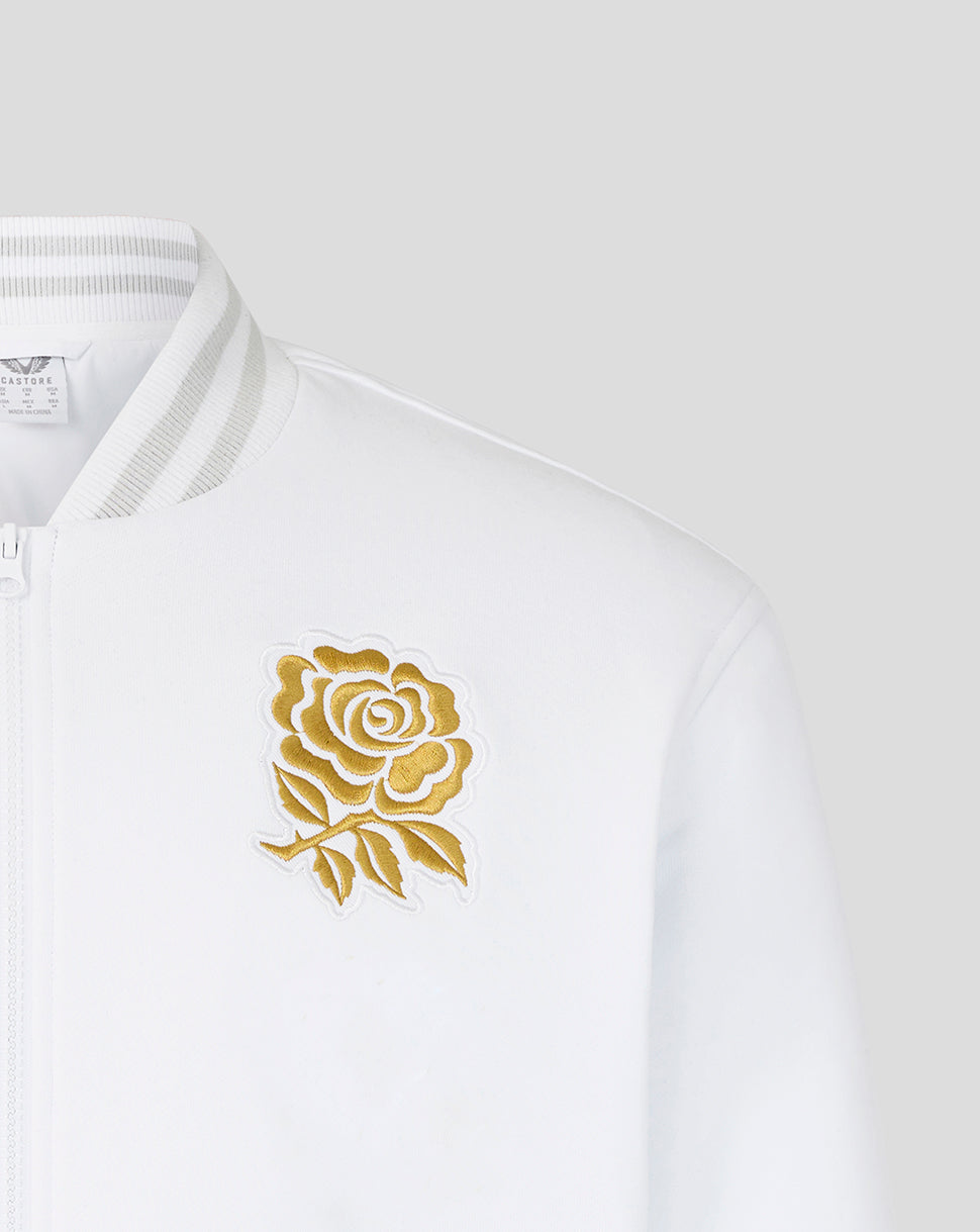 White bomber jacket close up showing gold rose embroidery on the left chest.