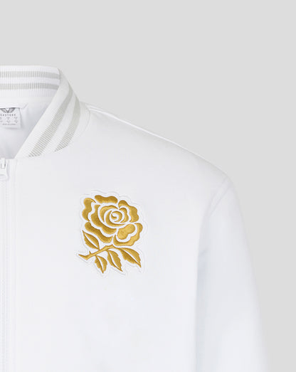 White bomber jacket close up showing gold rose embroidery on the left chest.