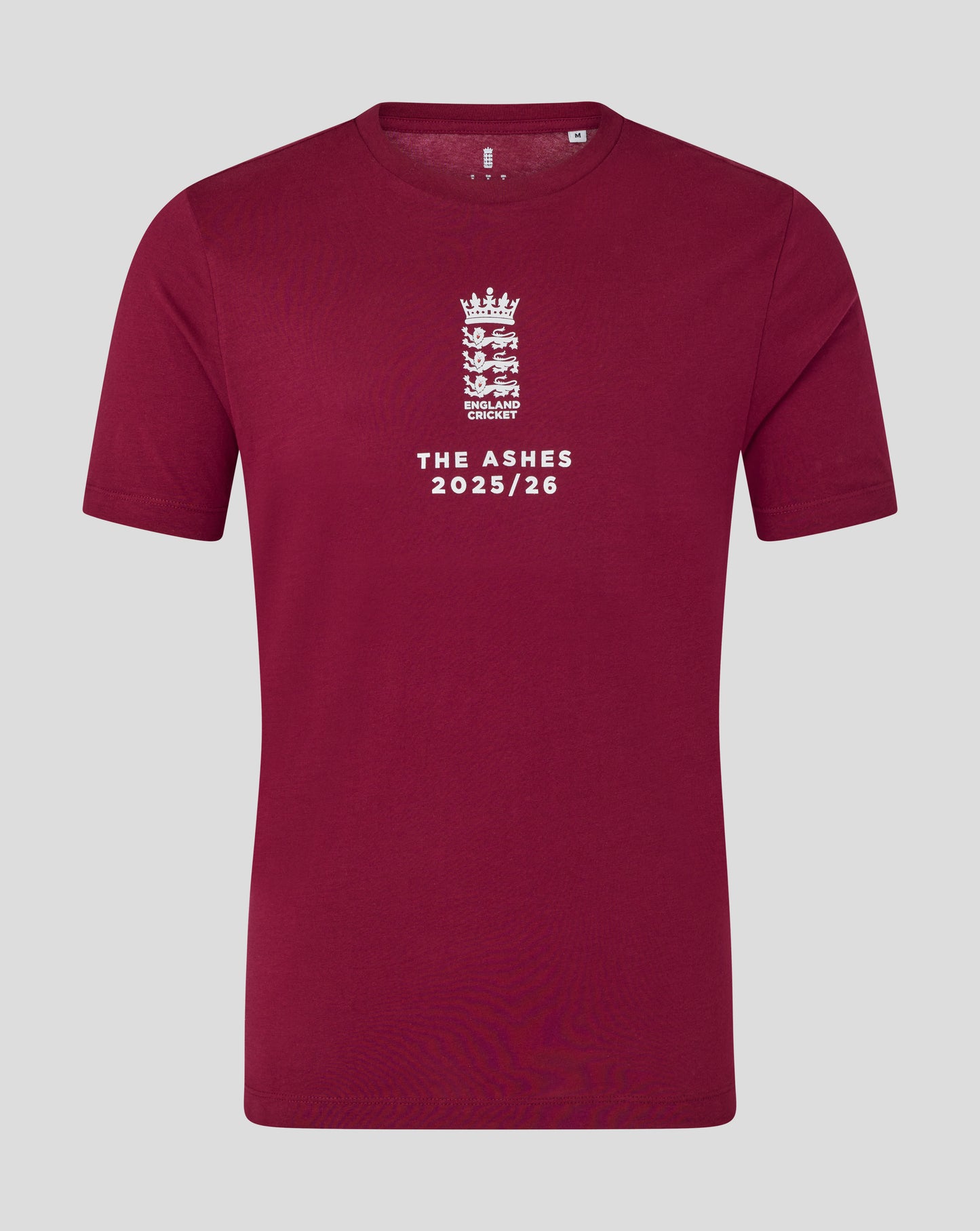 Burgundy England cricket T shirt close up with white crest and The Ashes 2025/26 text on front.