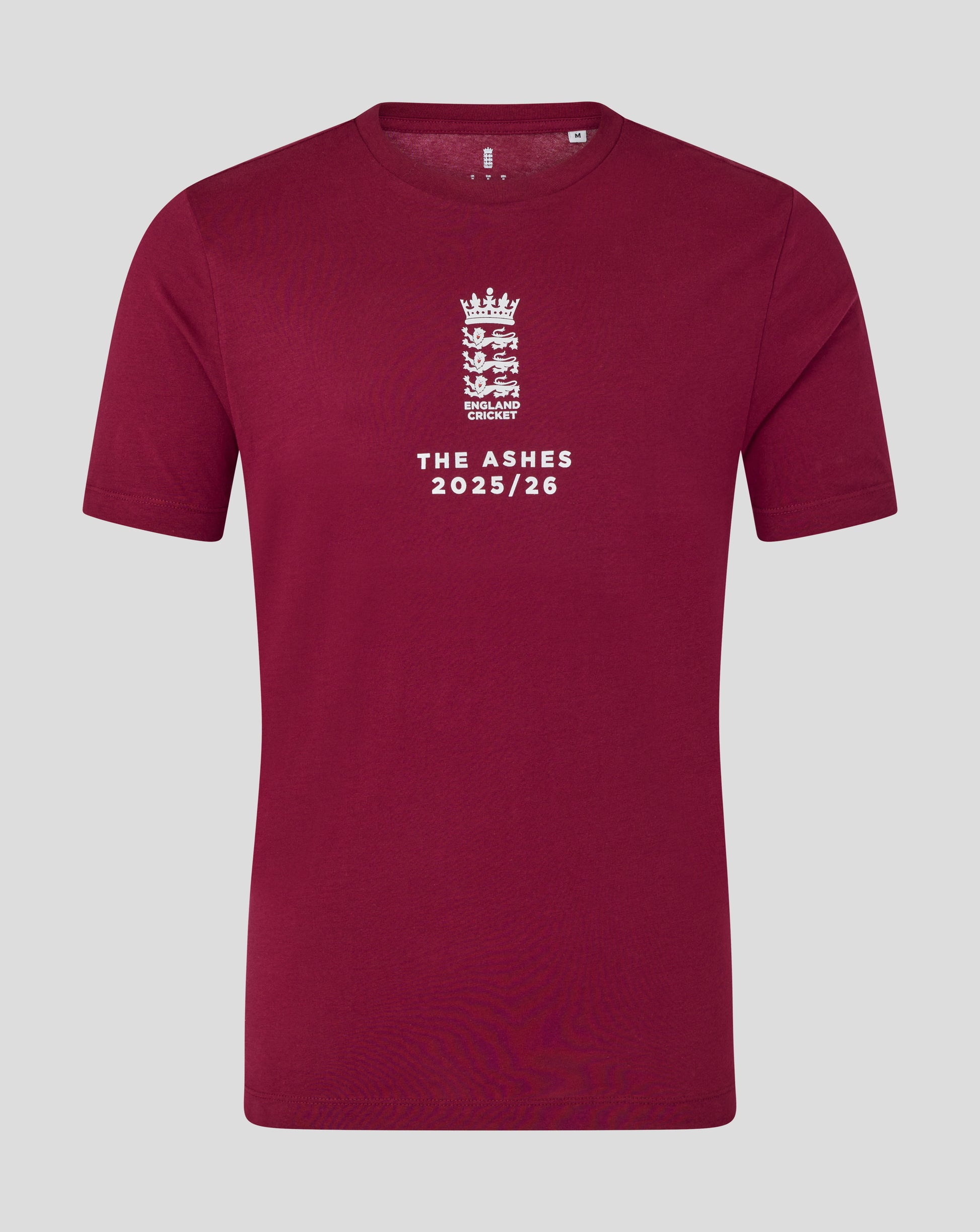 Burgundy England cricket T shirt close up with white crest and The Ashes 2025/26 text on front.