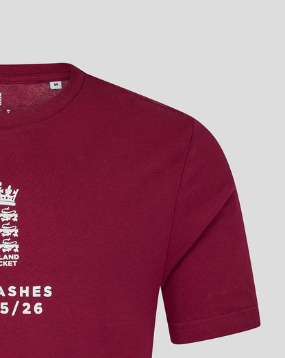 Close up of burgundy England cricket T shirt neckline with size M tag and partial crest print