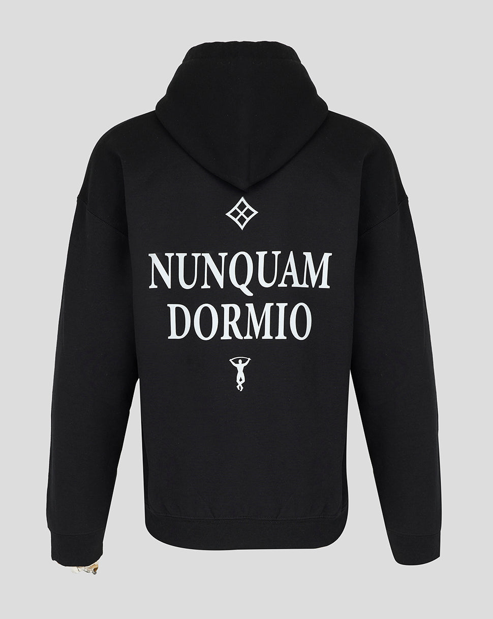 Back view of black Nunquam Dormio hoodie featuring large white typography and emblem on the upper back
