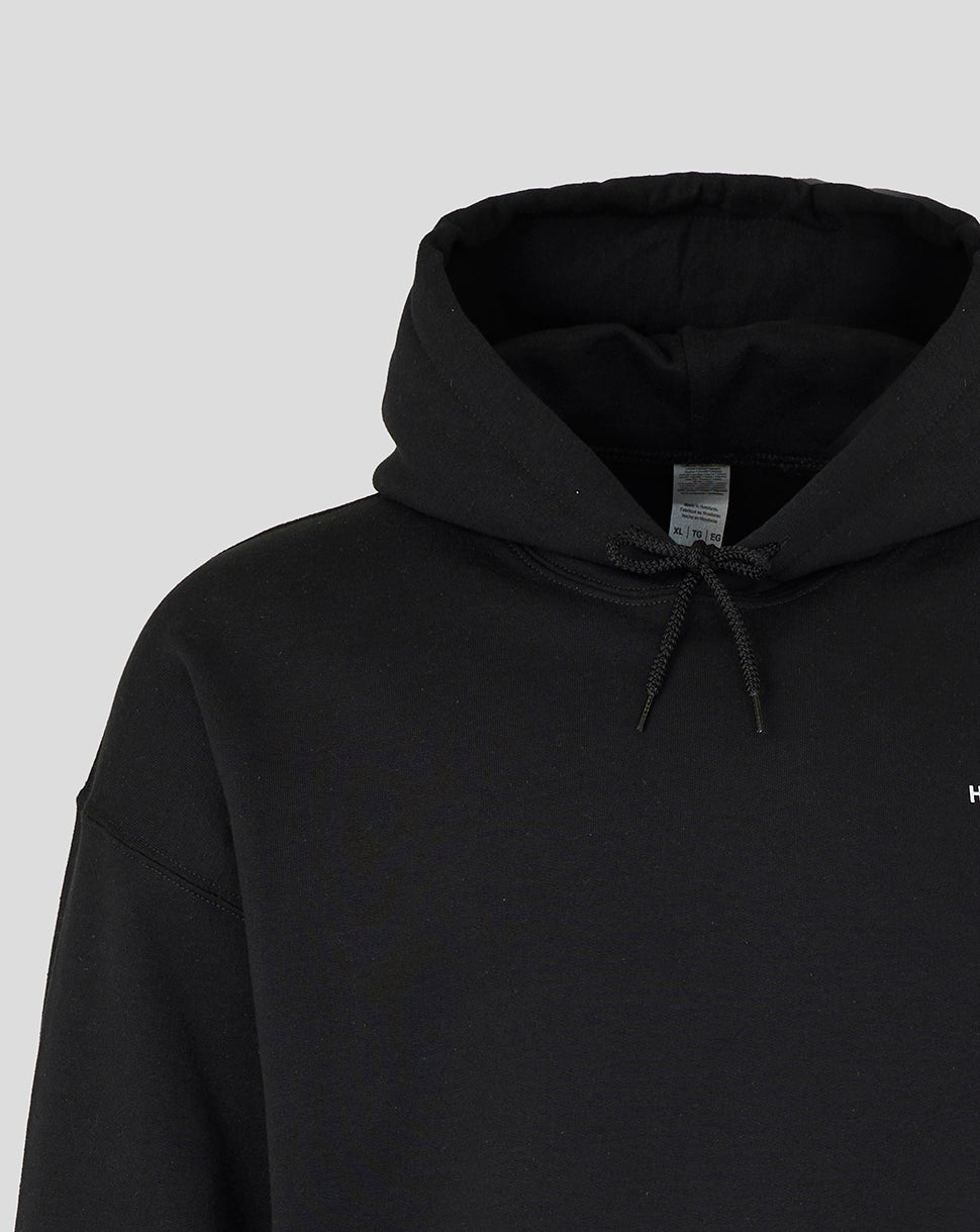 Close-up of black Nunquam Dormio hoodie showing drawstring hood and tag