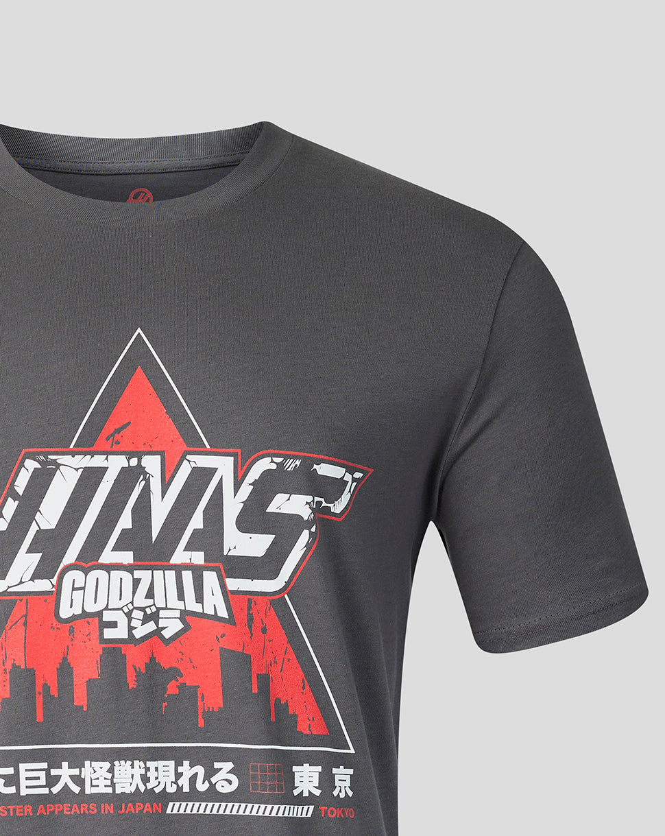 Close up of the Haas x Godzilla graphic on a dark gray tee showing bold white letters and a red accent.