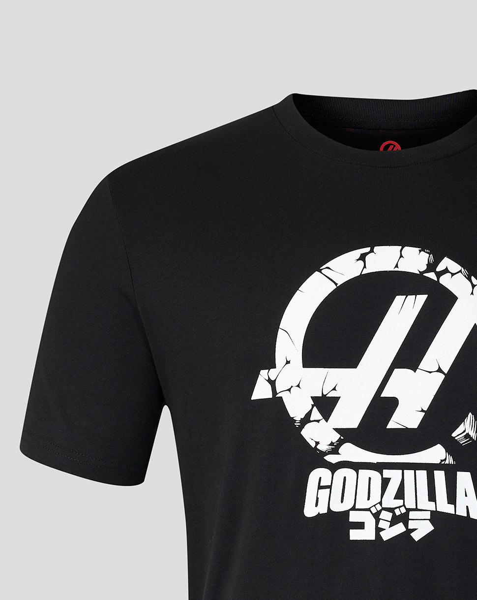 Close up of the front of the black Godzilla Tokyo Haas T shirt showing a large cracked circular emblem