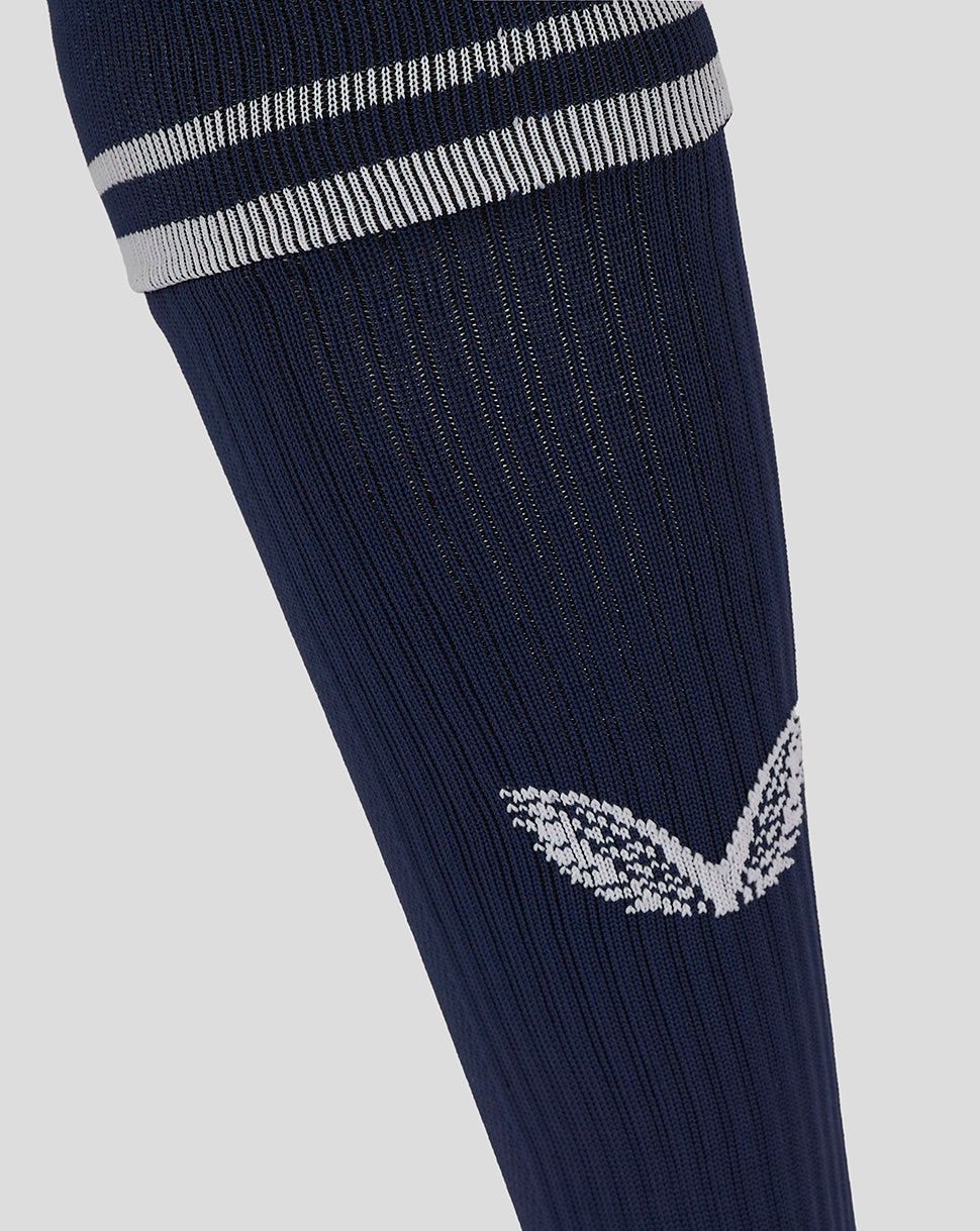 Navy football sock with white stripe cuff and white wing logo