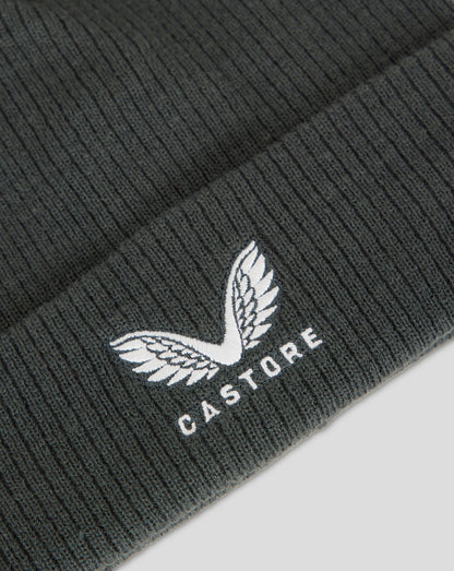 Dark slate ribbed knit beanie with fleece lining and embroidered Castore logo.
