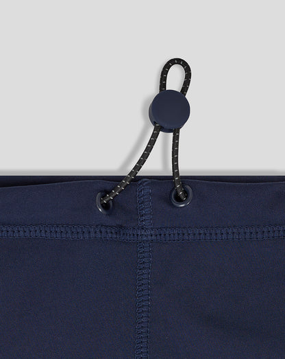 Close-up of navy snood showing cord with toggle threaded through eyelets