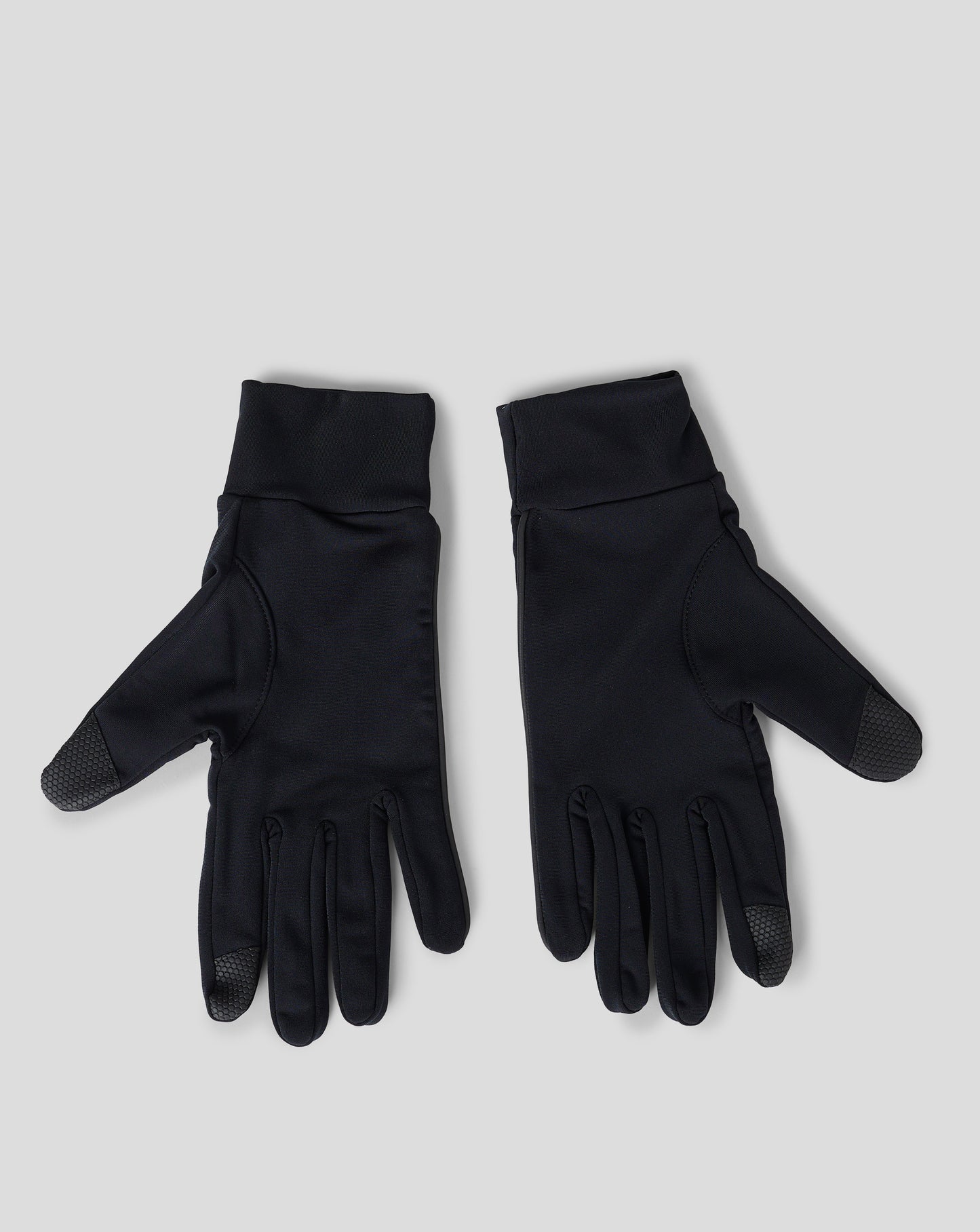 Gloves with white Castore wing logo visible on the cuffs