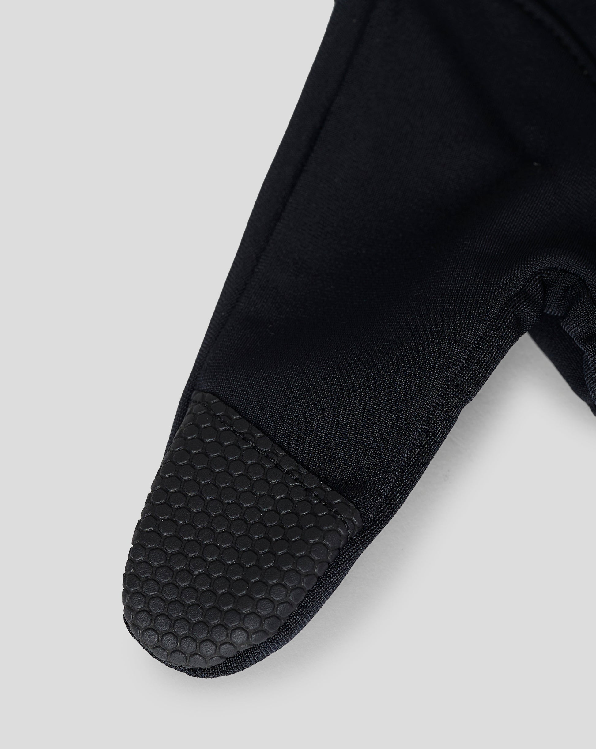 Black performance glove with folded cuff and reflective detail on the back of the hand and touch screen fingertips