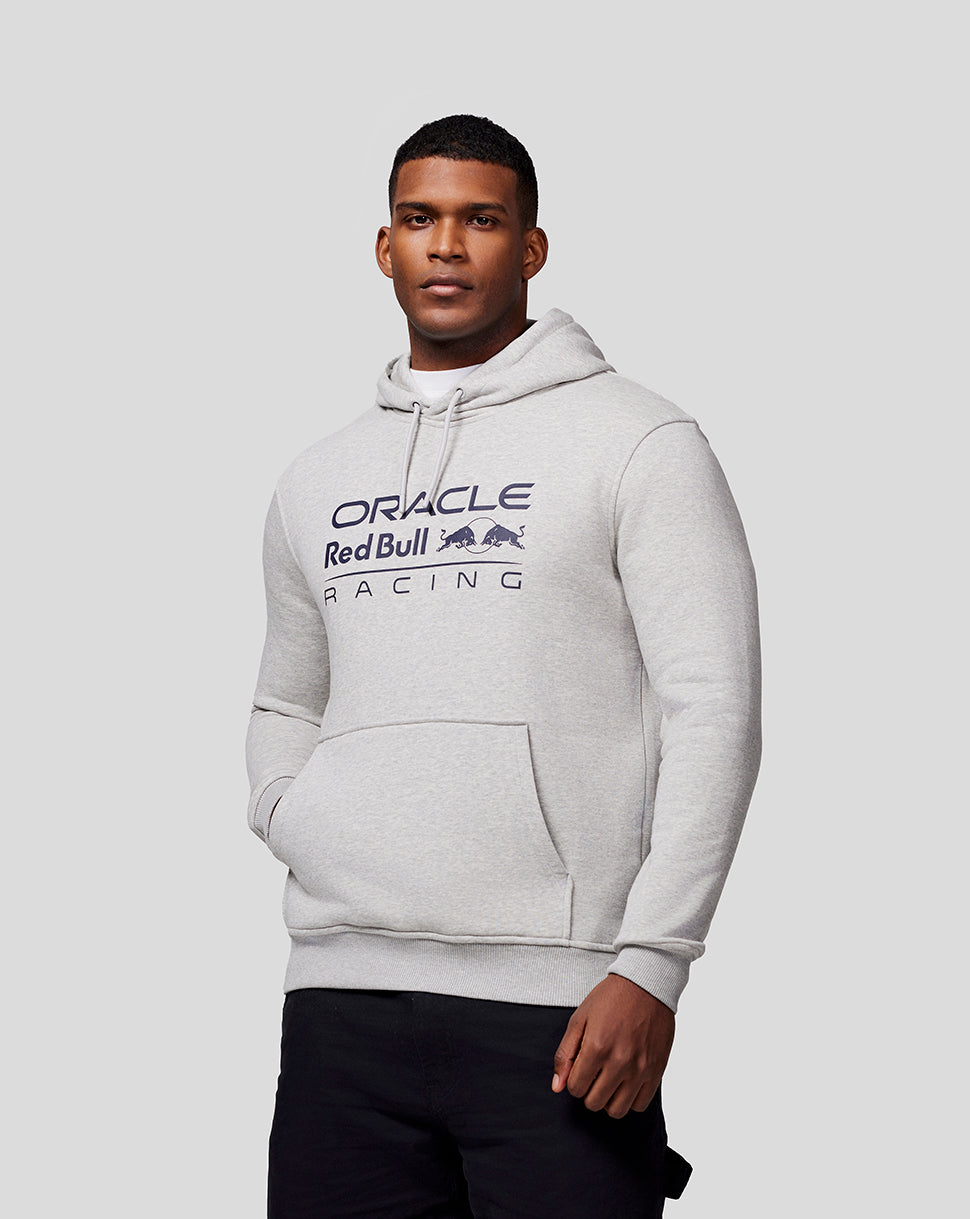 Male model in a light grey marl Oracle Red Bull Racing hoodie with chest logo and front kangaroo pocket