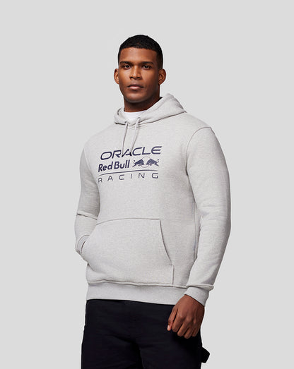 Male model in a light grey marl Oracle Red Bull Racing hoodie with chest logo and front kangaroo pocket
