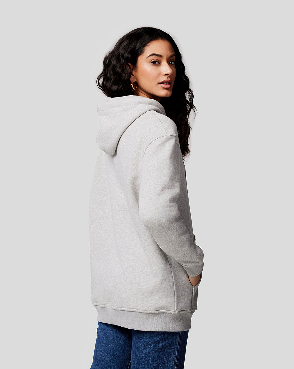 Woman wearing grey marl Oracle Red Bull Racing hoodie viewed from the back with hood down and kangaroo pocket.