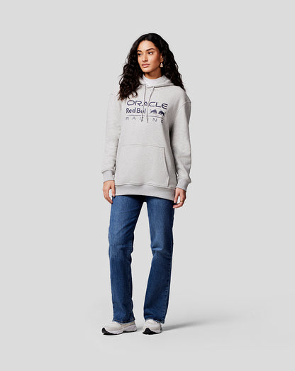 Female model in grey marl Oracle Red Bull Racing hoodie with large logo, paired with jeans and sneakers
