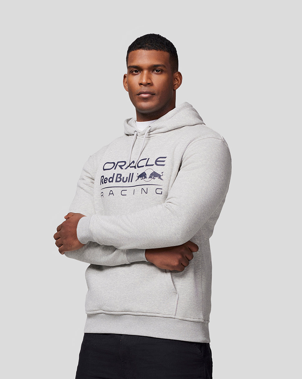 Male model in light grey marl hoodie with large Oracle Red Bull Racing chest logo and drawstring hood.