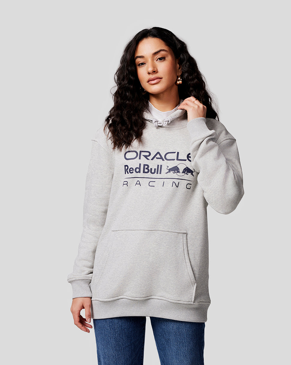 Woman wearing a light grey marl Oracle Red Bull Racing hoodie with chest logo