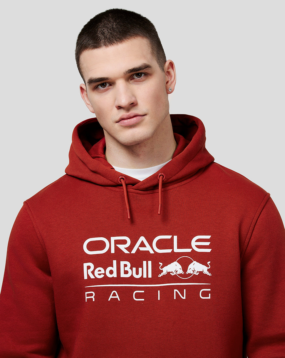 Male model wearing winery red Oracle Red Bull Racing hoodie with white front logo