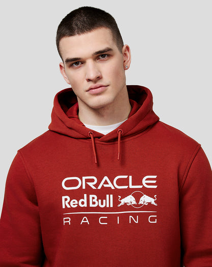 Male model wearing winery red Oracle Red Bull Racing hoodie with white front logo