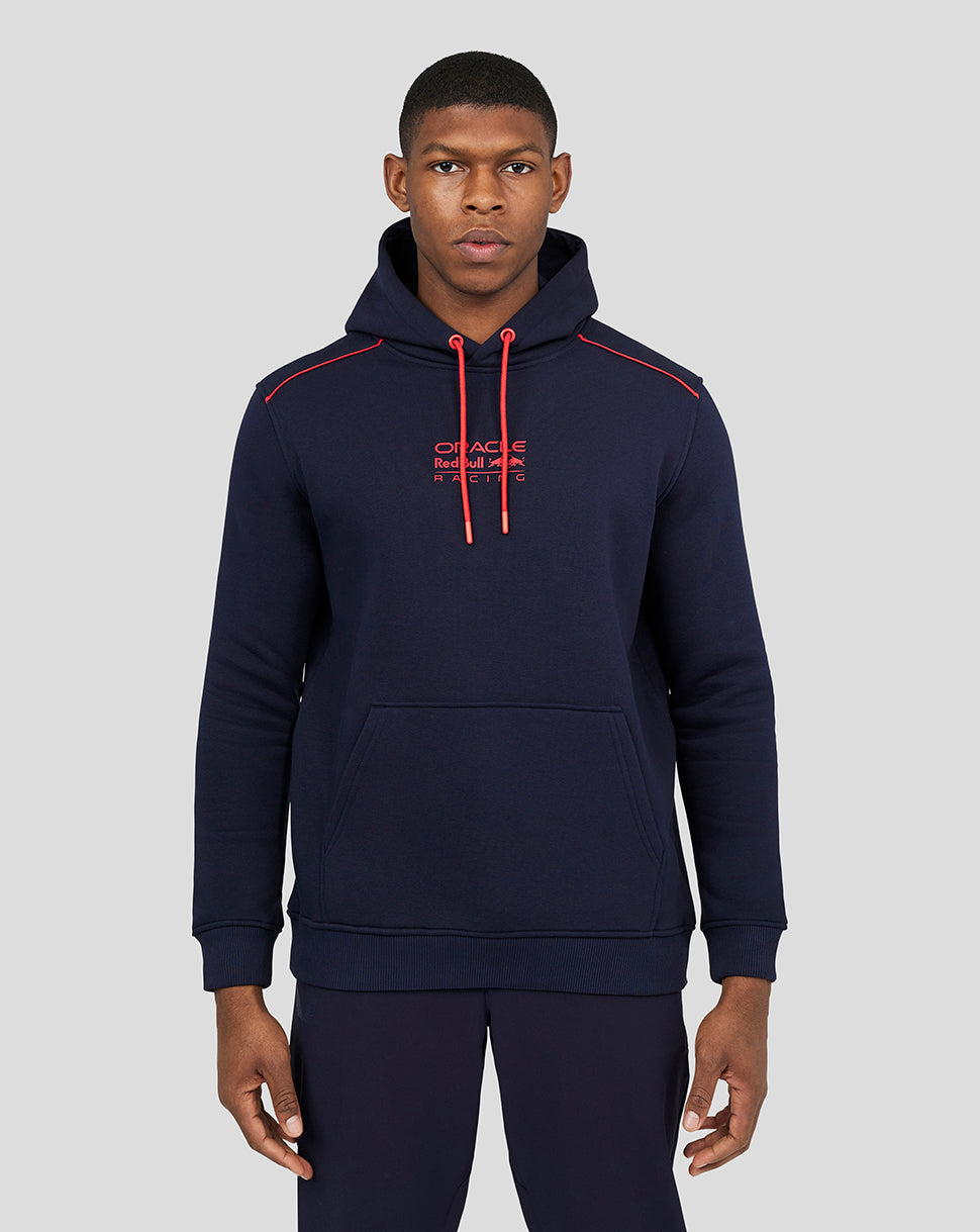 Male model wearing navy Oracle Red Bull Racing hoodie with red drawcords and a front kangaroo pocket