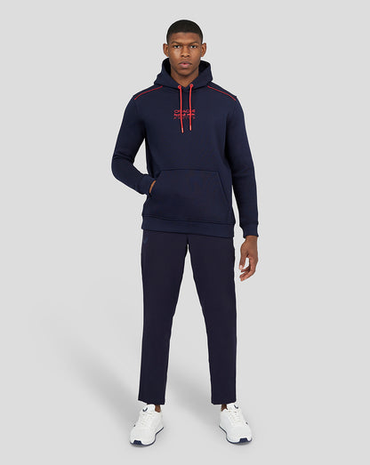 Front view of a man wearing a navy Oracle Red Bull Racing hoodie with red drawcords and a kangaroo pocket