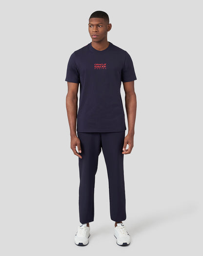 Front view of a man wearing a navy Oracle Red Bull Racing graphic T shirt with a small red logo on the chest.