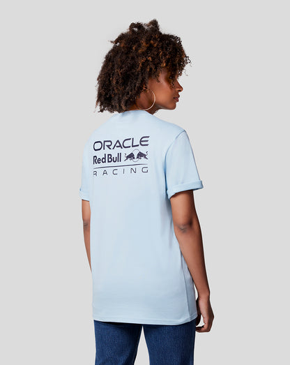 Back view of a woman wearing a Dream Blue Oracle Red Bull Racing Core Tee with large back branding.