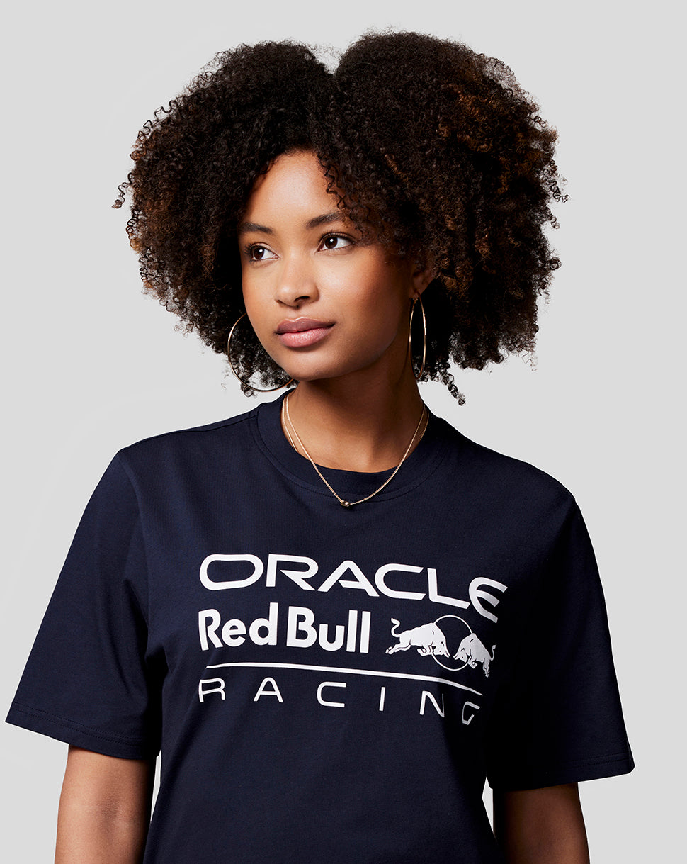 Model wearing navy Oracle Red Bull Racing T shirt with a large white logo on the chest