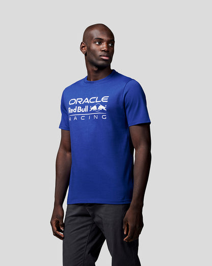Man wearing a blue Oracle Red Bull Racing T shirt with large white logo across the chest.