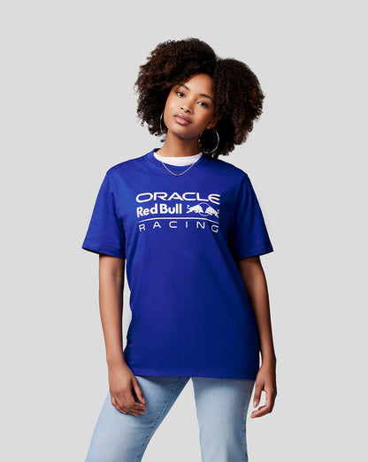 Woman wearing blue Oracle Red Bull Racing T shirt with white front logo.