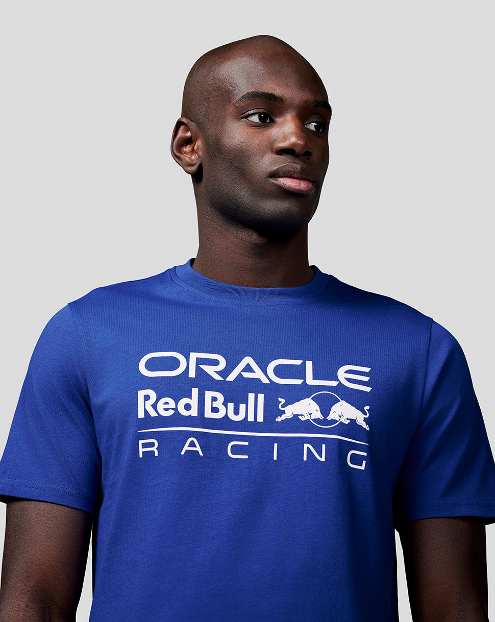 Male model wearing blue Oracle Red Bull Racing tee with large white logo on the chest