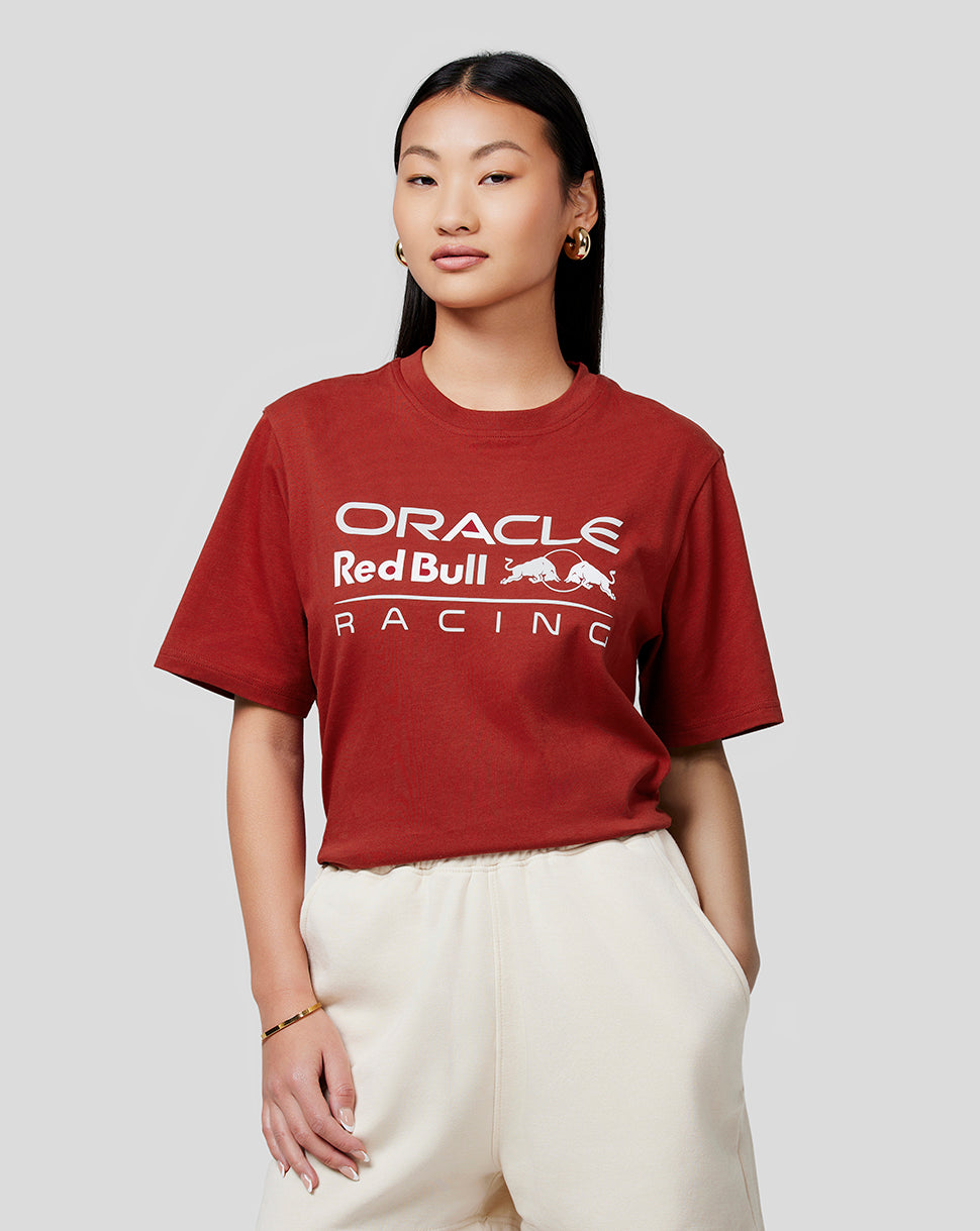 Woman wearing winery red Oracle Red Bull Racing logo T shirt with white chest graphic