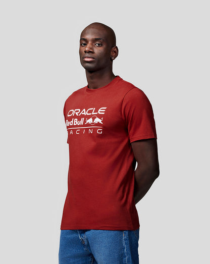 Man wearing a red Oracle Red Bull Racing T shirt with a bold white logo across the chest.