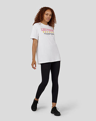 Side view of a female model wearing white Oracle Red Bull Racing T-shirt with Las Vegas graphic.