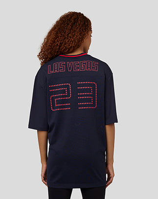 Rear view of a model wearing a navy Vegas football jersey with Las Vegas lettering and dotted 23 on the back