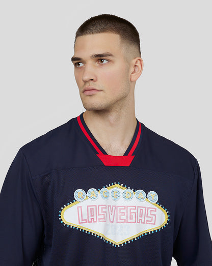Close-up of a man wearing Oracle Red Bull Racing Unisex Vegas American Football Jersey.