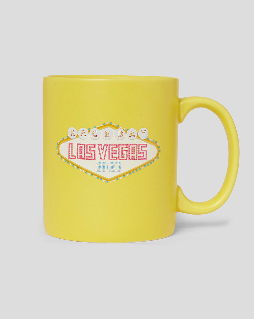 Yellow ceramic mug featuring a Las Vegas neon sign design