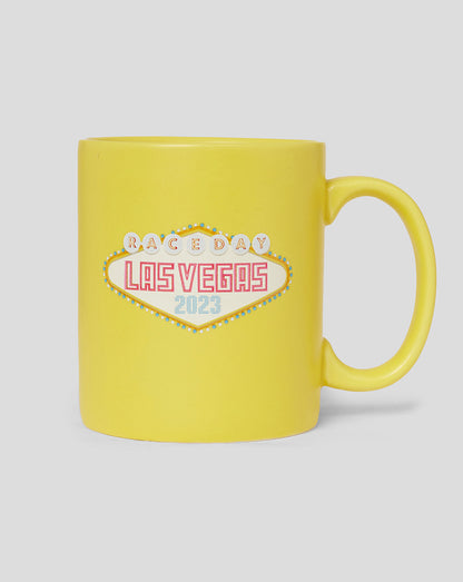 Yellow ceramic mug featuring a Las Vegas neon sign design
