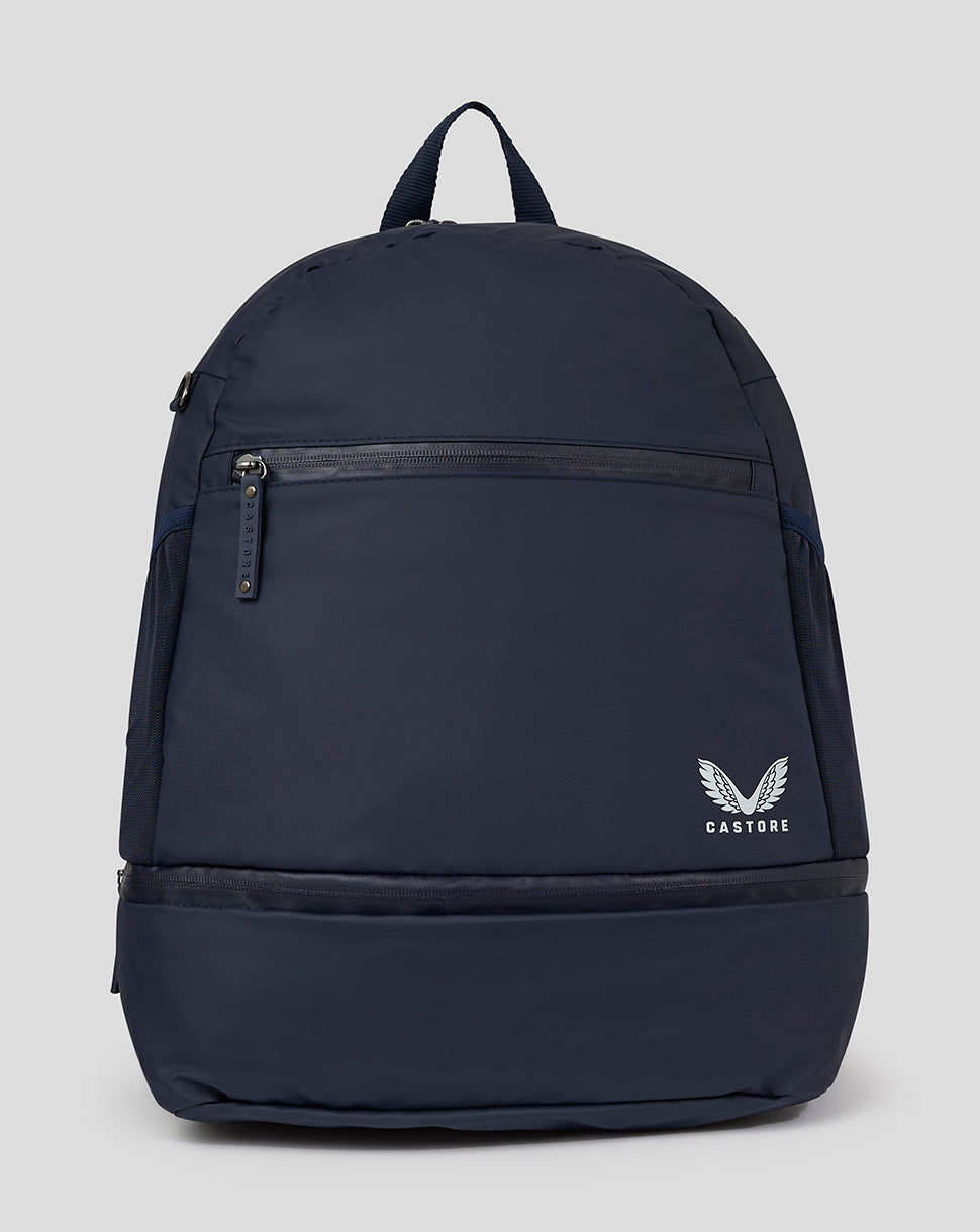Peacoat navy backpack with front zip pocket mesh side pockets and Castore logo on the lower front