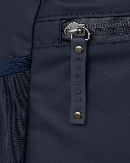 Close-up of navy zipper with Castore branded pull tab.