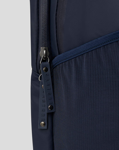 Close-up of navy backpack fabric with a side zipper and metal hardware.