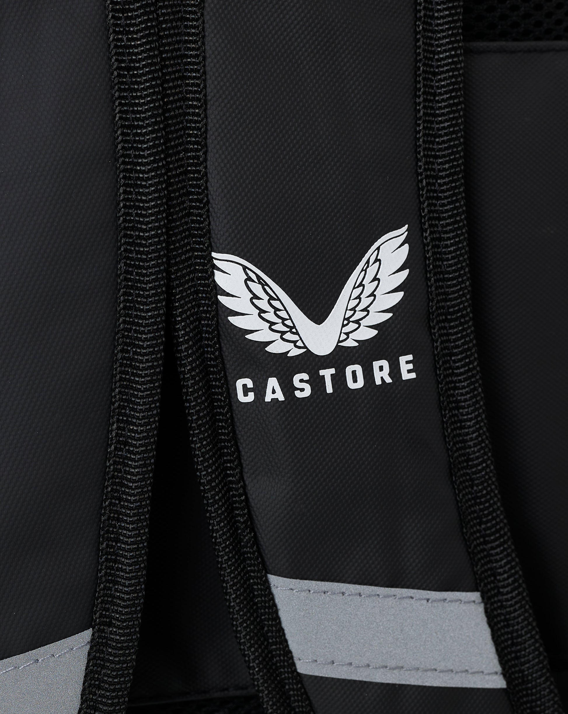 Close up of black backpack strap with Castore logo on the front panel