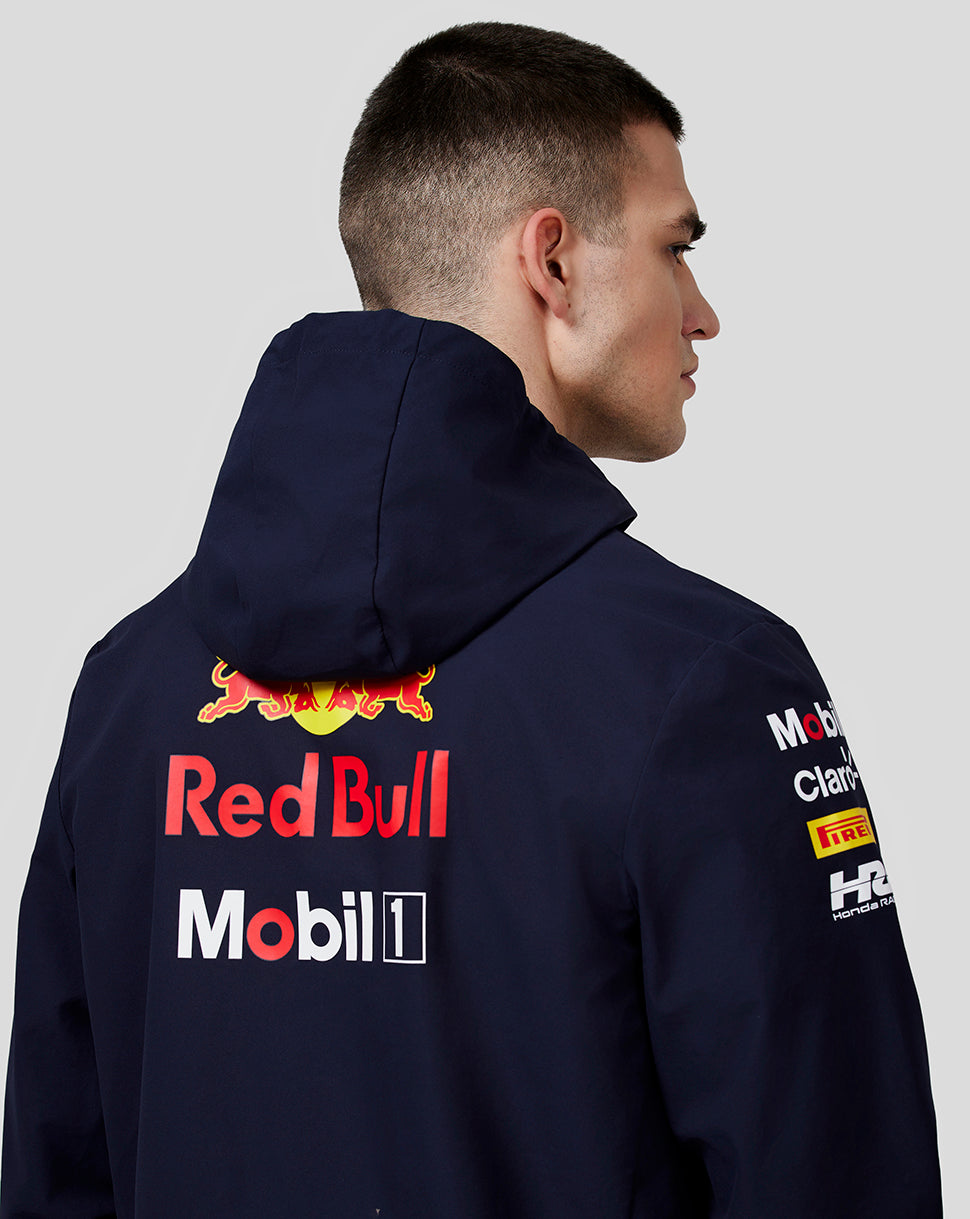 Back view of navy unisex water resistant jacket with large Red Bull and Mobil 1 logos.