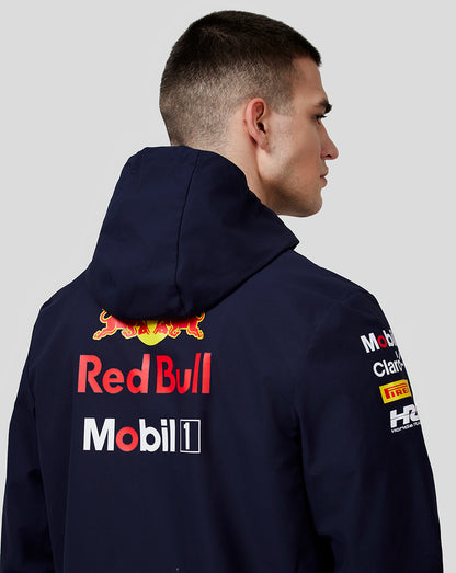 Back view of navy unisex water resistant jacket with large Red Bull and Mobil 1 logos.