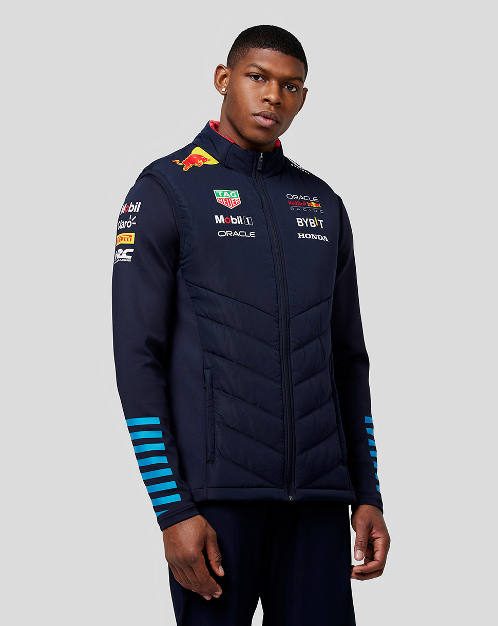 Model wearing navy night sky teamline hybrid gilet with padded quilted front panels.