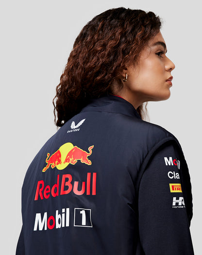 Back view of a model wearing the navy Night Sky Oracle Red Bull Racing Hybrid Gilet with bold Red Bull and Mobil 1 branding.