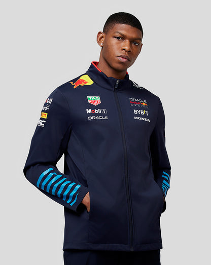 Male model in navy Oracle Red Bull Racing Teamline Soft Shell Jacket Night Sky with blue striped sleeves
