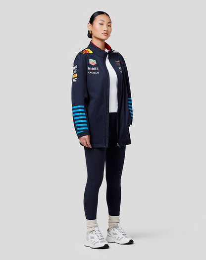 Female model in navy Oracle Red Bull Racing Teamline Soft Shell Jacket Night Sky with red collar